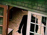 Officials enter Cobains greenhouse in Seattle on April 8, 1994.