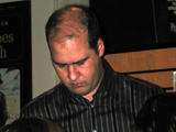 Krist takes a moment before beginning his lecture.